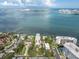 Expansive aerial view showcases the waterfront, pier, and surrounding city skyline, emphasizing the area's prime location at 602 Lime Ave # 102, Clearwater, FL 33756