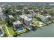 Aerial view of the condominium complex with pool and waterfront access, showing prime location at 602 Lime Ave # 102, Clearwater, FL 33756