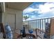 Cozy balcony featuring comfortable seating and views of the water, ideal for morning coffee at 602 Lime Ave # 102, Clearwater, FL 33756
