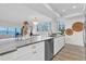 This kitchen features stainless steel appliances, an island, and great light at 602 Lime Ave # 102, Clearwater, FL 33756