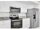 Modern kitchen featuring stainless steel appliances and white cabinets at 602 Lime Ave # 102, Clearwater, FL 33756
