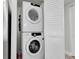 Stacked washer and dryer in a dedicated laundry area for convenient in-unit laundry at 602 Lime Ave # 102, Clearwater, FL 33756