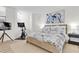 Serene main bedroom with a plush bed, coastal artwork, and a fitness area with bike at 602 Lime Ave # 102, Clearwater, FL 33756