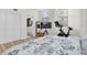 Cozy main bedroom featuring access to the en-suite bathroom, a Peloton bike, and window at 602 Lime Ave # 102, Clearwater, FL 33756