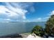 Breathtaking waterfront view showcasing the open water and distant cityscape, enhancing the property's appeal at 602 Lime Ave # 102, Clearwater, FL 33756