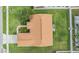 Aerial view of the house showcases the roof, backyard, and proximity to neighboring homes at 7046 Frascati Loop, Wesley Chapel, FL 33544