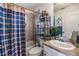 Full bathroom with shower-tub combo, vanity, and decorative accents at 7046 Frascati Loop, Wesley Chapel, FL 33544