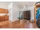 Bright room featuring hardwood floors, chandelier lighting, and simple decor at 7046 Frascati Loop, Wesley Chapel, FL 33544