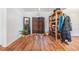 Bright room featuring hardwood floors, chandelier lighting, and simple decor at 7046 Frascati Loop, Wesley Chapel, FL 33544