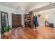 Bright room featuring hardwood floors, chandelier lighting, and simple decor at 7046 Frascati Loop, Wesley Chapel, FL 33544