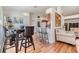 Cozy dining area with seating, adjacent to the living room, perfect for casual meals at 7046 Frascati Loop, Wesley Chapel, FL 33544