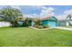 Charming home with lush landscaping, well-maintained lawn, and inviting curb appeal at 7046 Frascati Loop, Wesley Chapel, FL 33544