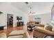 Spacious living room with wood floors, neutral decor, and plenty of natural light at 7046 Frascati Loop, Wesley Chapel, FL 33544