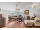 Inviting living room with wood floors and neutral furnishings, perfect for relaxing at 7046 Frascati Loop, Wesley Chapel, FL 33544
