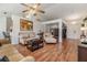 Bright living room featuring hardwood floors, recessed lighting and neutral furnishings at 7046 Frascati Loop, Wesley Chapel, FL 33544