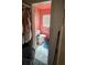 Compact yet functional pink bathroom features a toilet, sink, and a window for natural light at 714 Gray S St, Gulfport, FL 33707