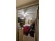 Functional bedroom featuring ceiling fan, with natural light and furniture; great starter space at 714 Gray S St, Gulfport, FL 33707