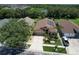 Charming single-story home with solar panels, a well-maintained yard, and a long driveway in a quiet neighborhood at 7254 Parkersburg Dr, Wesley Chapel, FL 33545