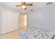 Spacious bedroom with a ceiling fan, closet space, and natural light at 7254 Parkersburg Dr, Wesley Chapel, FL 33545