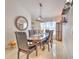 Well-appointed dining room featuring a large table with comfortable chairs, and elegant decor at 7254 Parkersburg Dr, Wesley Chapel, FL 33545