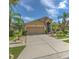 Charming home with a spacious driveway and meticulously landscaped front yard at 7254 Parkersburg Dr, Wesley Chapel, FL 33545