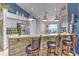Eat-in kitchen features a breakfast bar, granite counters, and stainless steel appliances at 7254 Parkersburg Dr, Wesley Chapel, FL 33545