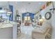 Open-concept living room with vaulted ceilings, stylish furnishings, and seamless flow to the kitchen at 7254 Parkersburg Dr, Wesley Chapel, FL 33545