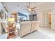 Bright living room showcases neutral decor, an open layout, and a seamless flow to the kitchen at 7254 Parkersburg Dr, Wesley Chapel, FL 33545