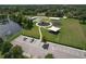 Community park featuring a playground, parking lot, and tennis courts by the lake at 7254 Parkersburg Dr, Wesley Chapel, FL 33545