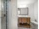 Bathroom with a decorative shower and a rustic wood vanity at 745 Bruce Ave, Clearwater Beach, FL 33767