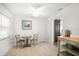 Bright dining area with decorative table, chairs, and sliding barn door at 745 Bruce Ave, Clearwater Beach, FL 33767
