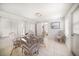 Bright dining area with wicker chairs, tile floors, and ample natural light at 745 Bruce Ave, Clearwater Beach, FL 33767