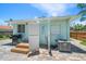 Exterior view of home featuring an outdoor shower and grill at 745 Bruce Ave, Clearwater Beach, FL 33767