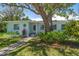 Charming home exterior with lush landscaping and a welcoming entryway at 745 Bruce Ave, Clearwater Beach, FL 33767