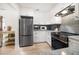 Bright kitchen features stainless steel appliances, modern countertops, and white cabinetry at 745 Bruce Ave, Clearwater Beach, FL 33767