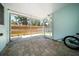 Screened patio with paver flooring and view of the fenced backyard at 745 Bruce Ave, Clearwater Beach, FL 33767
