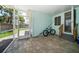 Covered patio with tiled flooring perfect for outdoor living, and a bicycle at 745 Bruce Ave, Clearwater Beach, FL 33767