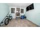 Enclosed patio with tiled floor has easy access to the outdoors, offering convenience at 745 Bruce Ave, Clearwater Beach, FL 33767