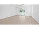 Bright bedroom featuring hardwood floors, recessed lighting, and large windows at 7617 Alvina St, Tampa, FL 33625