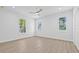 Bright bedroom with sleek hardwood flooring, recessed lighting, and natural light at 7617 Alvina St, Tampa, FL 33625