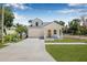 Beautiful two-story home with a manicured lawn, attached garage, and a traditional-style facade at 7617 Alvina St, Tampa, FL 33625