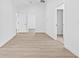 Hallway with light wood floors and white walls for a bright, airy feel at 7617 Alvina St, Tampa, FL 33625