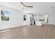 Spacious kitchen and living area combo with hardwood floors and natural lighting at 7617 Alvina St, Tampa, FL 33625