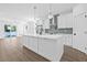 Modern kitchen with white cabinets, stainless steel appliances, and island at 7617 Alvina St, Tampa, FL 33625