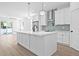 Modern kitchen with white cabinets, stainless steel appliances, and an island at 7617 Alvina St, Tampa, FL 33625