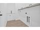Clean laundry room with custom cabinets, stainless steel sink, and modern hardware at 7617 Alvina St, Tampa, FL 33625