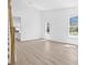 Bright living space with wood floors, white walls, and large windows at 7617 Alvina St, Tampa, FL 33625