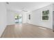 Spacious living room with sleek hardwood flooring, recessed lighting, and natural light at 7617 Alvina St, Tampa, FL 33625