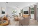 Bright living room with neutral furniture, large windows and sliding glass door at 7617 Alvina St, Tampa, FL 33625