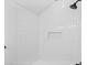 Shower with white subway tile, black fixtures, and a built-in niche at 7617 Alvina St, Tampa, FL 33625